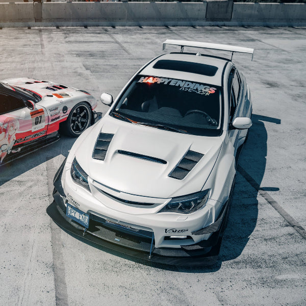 rxy and white subaru with happy endings banners.