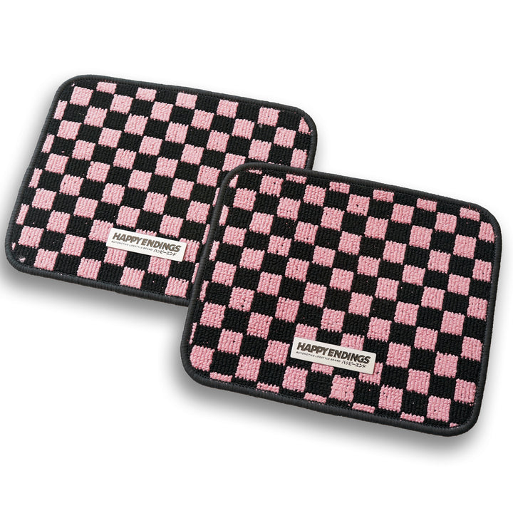 Baby pink checkerboard rear seat floor mats with black trim, sold as a pair