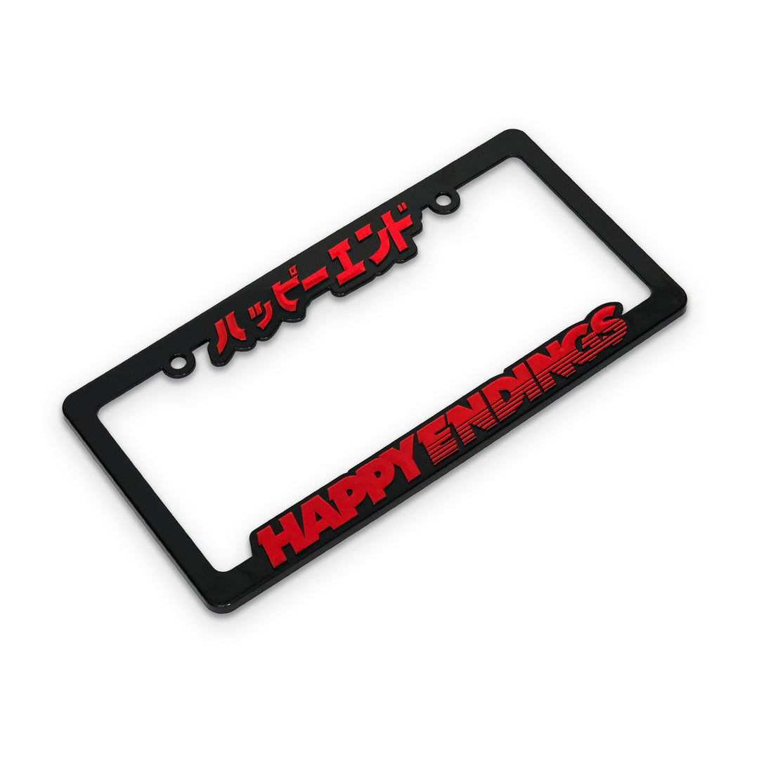 Black license plate frame with red text 'HAPPY ENDINGS' on a white background