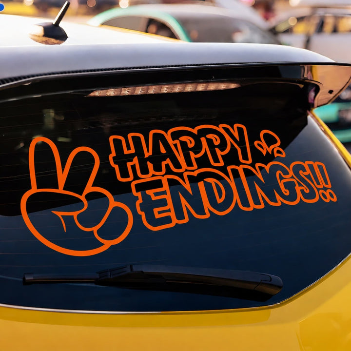 Orange decal on a car rear window depicting a peace sign and the text Happy Endings!!.