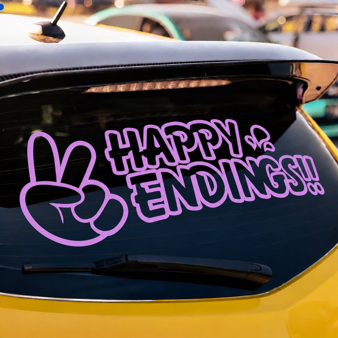 A yellow car rear window with a purple decal of a peace sign and the text HAPPY ENDINGS!!.