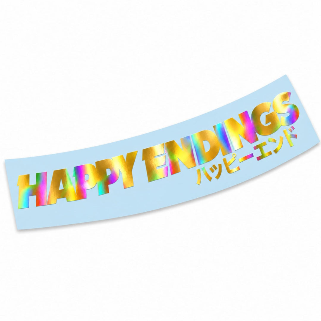 A light blue banner featuring the text HAPPY ENDINGS in iridescent letters and Japanese script.