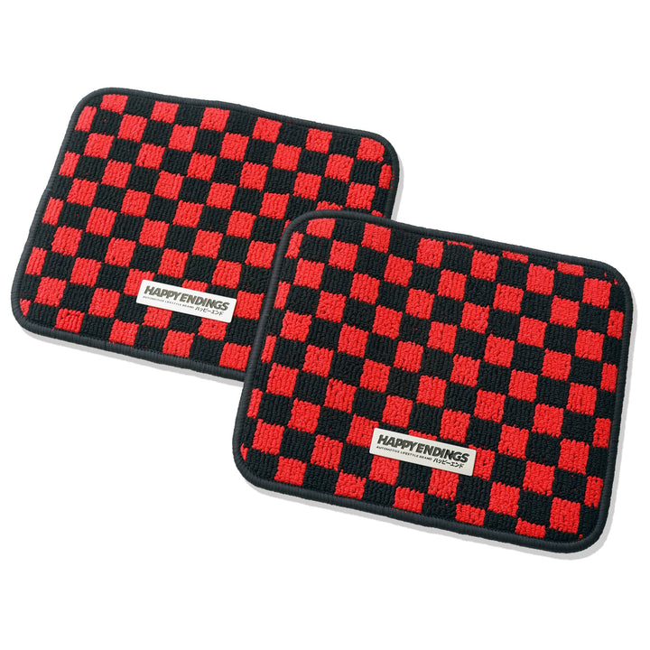 Two rectangular mats with red and black checkered patterns and HAPPY ENDINGS labels on each mat.