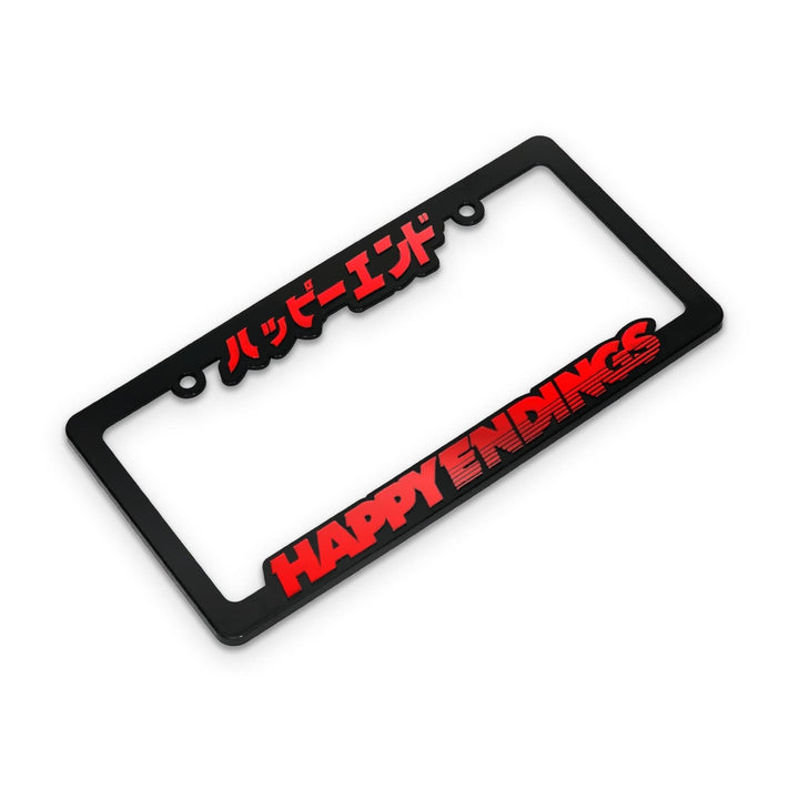 Black license plate frame with red HAPPY ENDINGS and Japanese text on the top, against a white background.