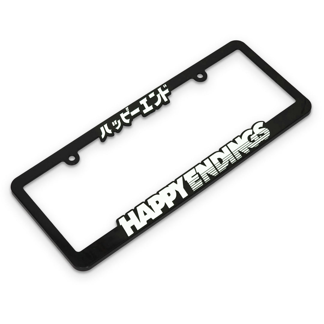 Black license plate frame with 'HAPPY ENDINGS' text in white
