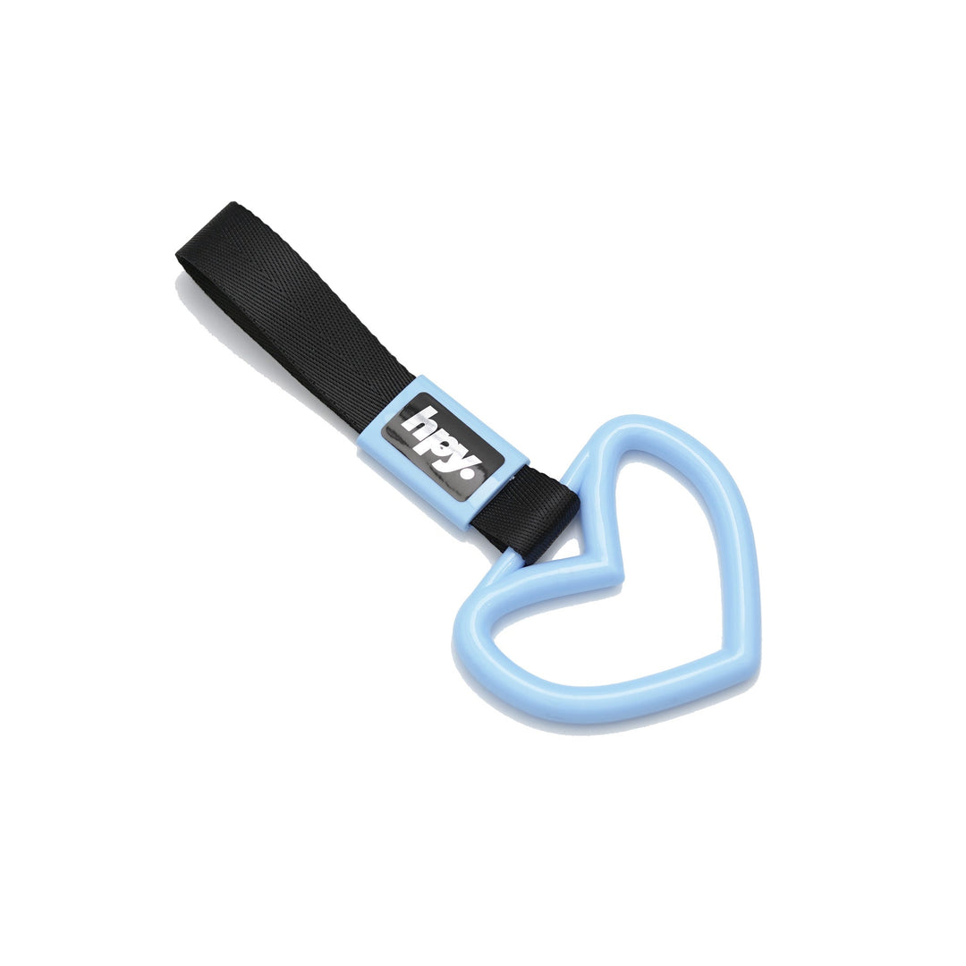 Baby blue heart tsurikawa handle with black strap on a white background