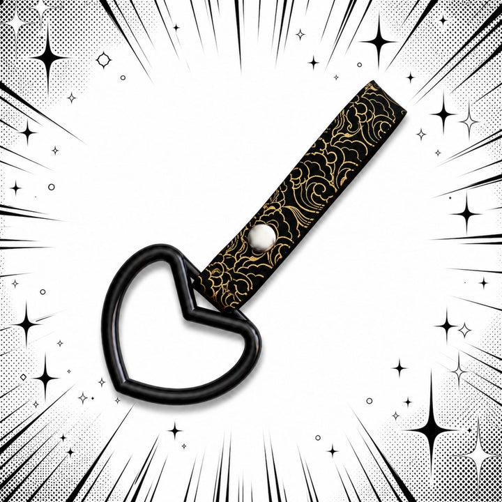 Black heart-shaped handle on a black strap with a gold cloud pattern.
