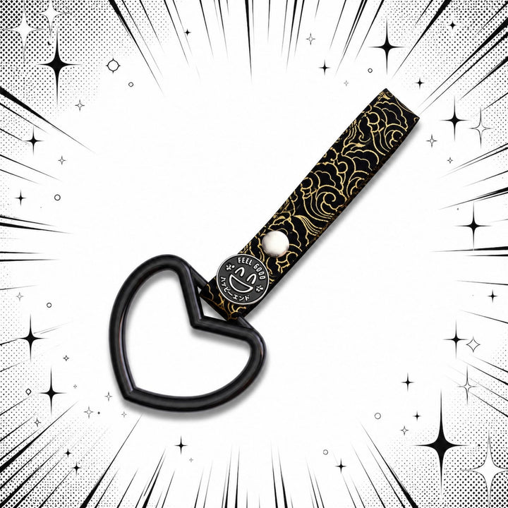 Black heart-shaped object with patterned strap, set on a comic-style burst background with sparkles.