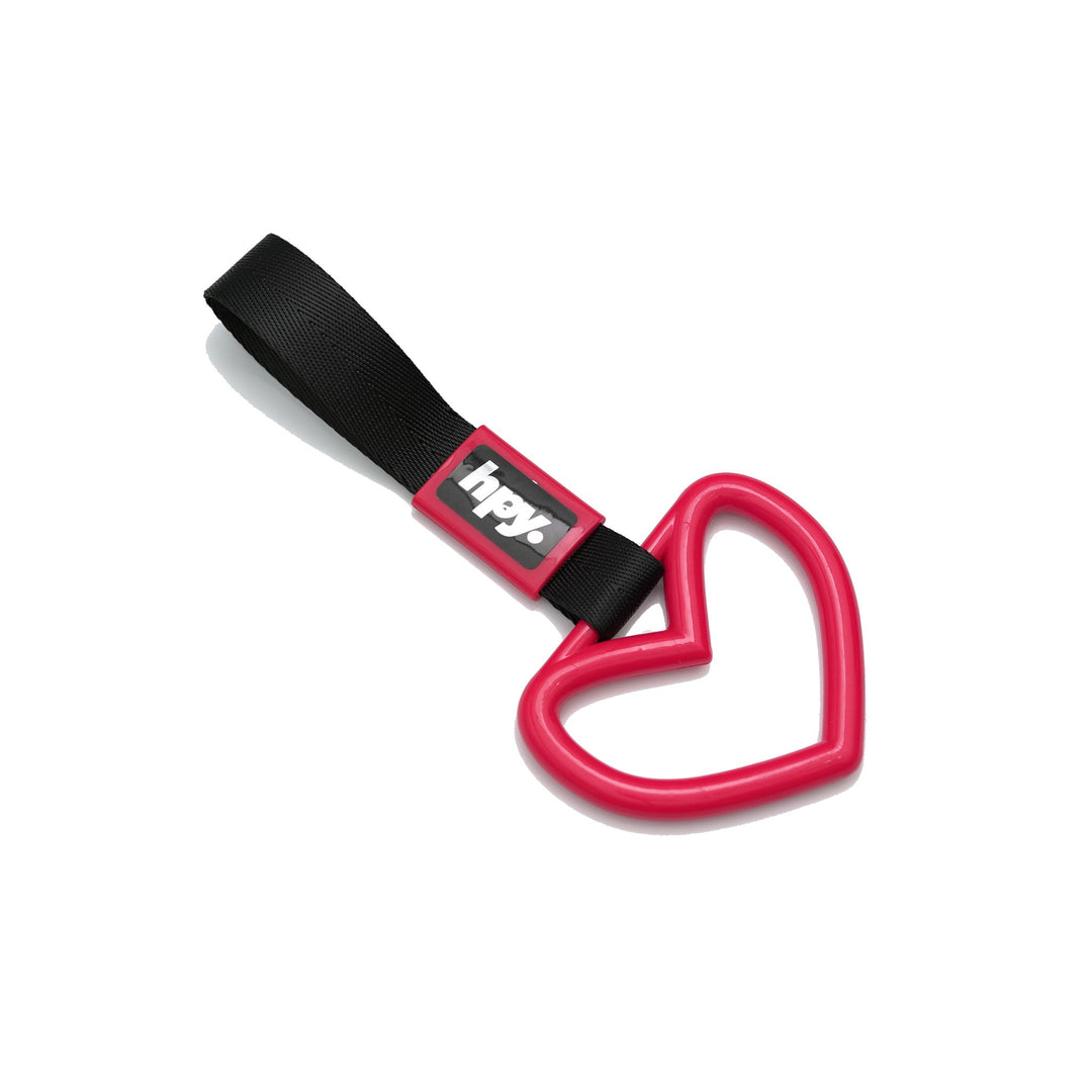 Red heart tsurikawa handle with black strap on a white background