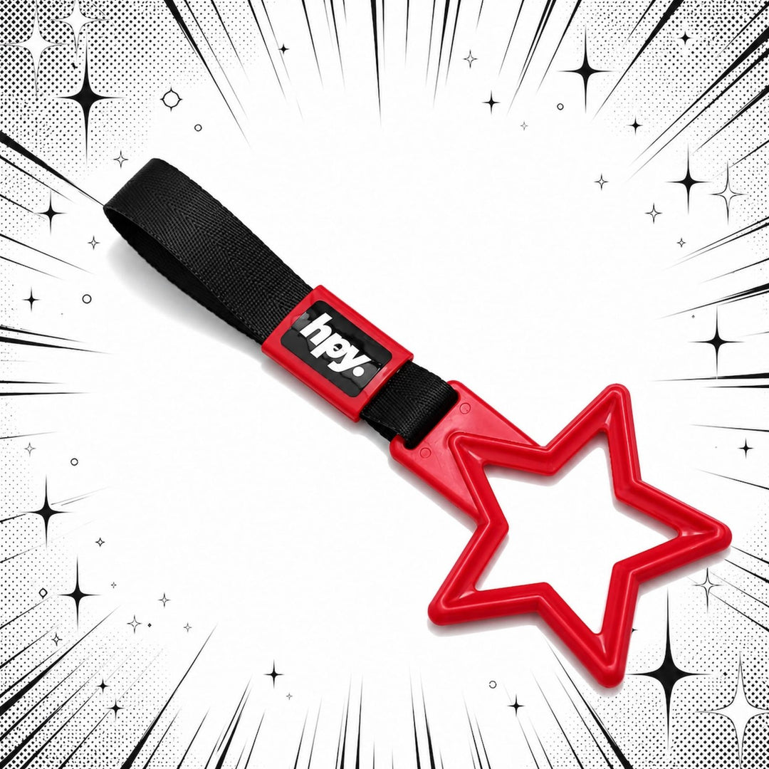 A red star-shaped plastic tool with a black strap labeled hpy on a comic-styl...