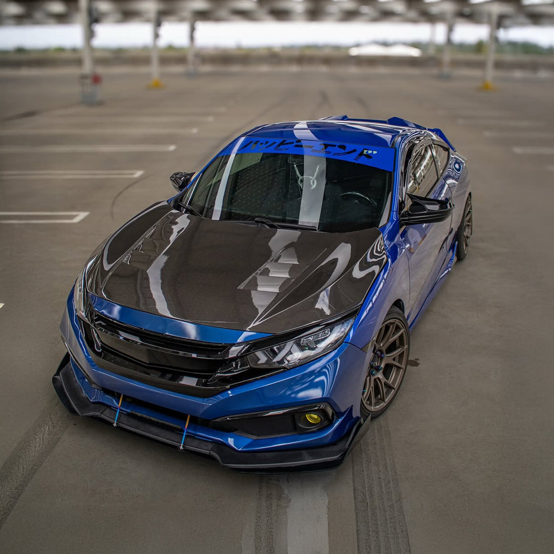 Blue and black car in a parking lot