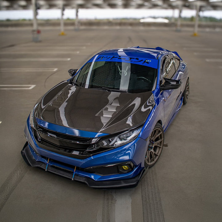 Blue and black car in a parking lot