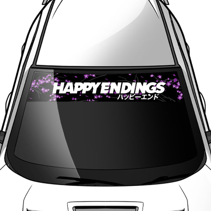 Car window with 'HAPPY ENDINGS' decal and purple floral design